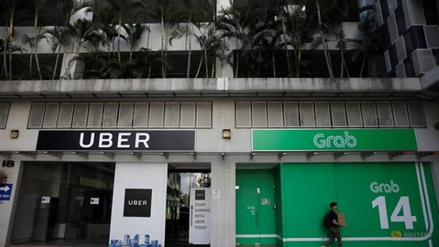 Grab, Uber fined nearly 10 million USD in Singapore hinh anh 1
