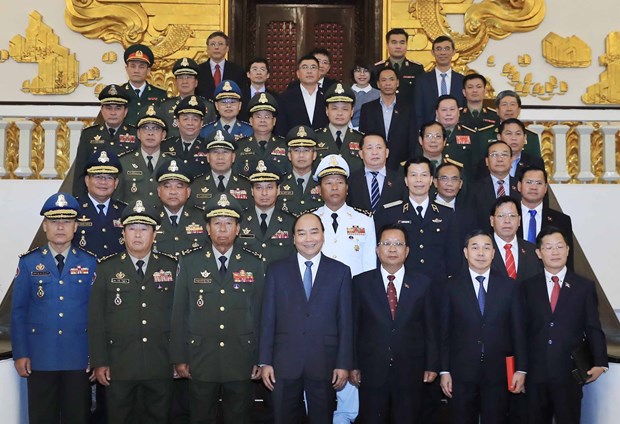 PM welcomes Cambodian, Lao defence ministers hinh anh 1