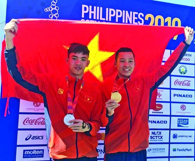 After SEA Games, swimmer Tran Tan Trieu hits open waters hinh anh 1