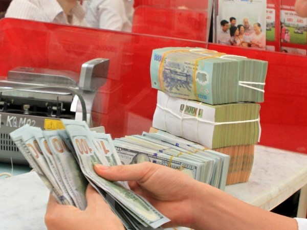 Reference exchange rate revised down 9 VND hinh anh 1