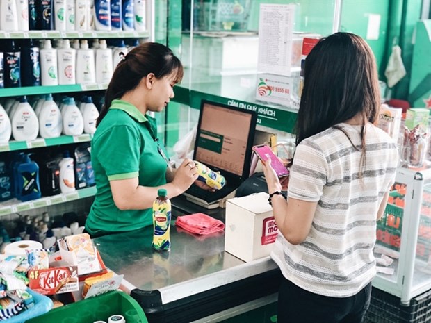 Banks, fintech firms promote cashless payments during epidemic hinh anh 1