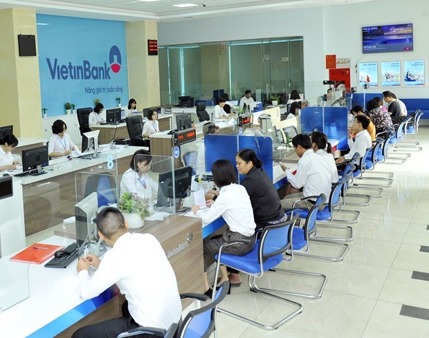 Local commercial banks cut interbank transfer fees hinh anh 1