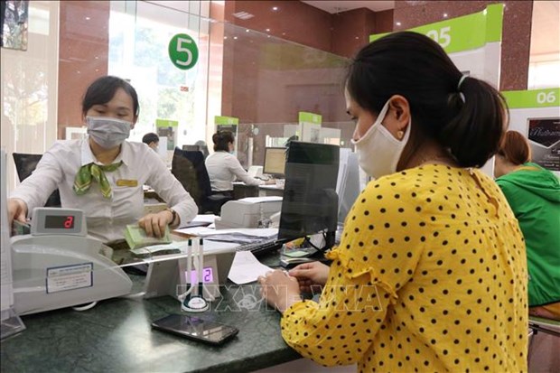 SBV’s policy rate cut a positive sign for market, economy: experts hinh anh 1