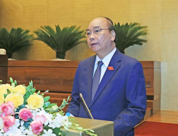 PM highlights anti-COVID-19 efforts, recovery solutions in report to legislature hinh anh 1