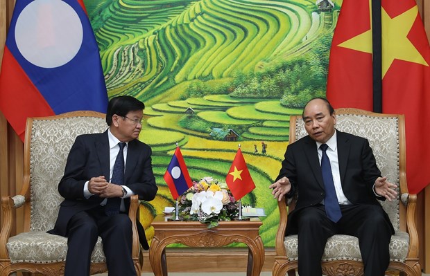 Prime Minister hosts Lao counterpart hinh anh 1
