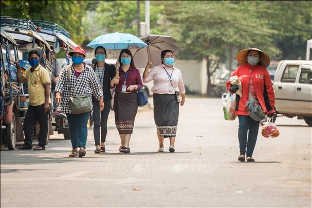 Laos enhances COVID-19 prevention measures during New Year festival hinh anh 1