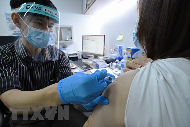Singapore boasts world highest COVID-19 vaccination rate hinh anh 1