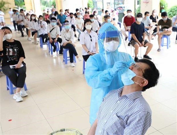 Vietnam reports additional 11,527 COVID-19 cases hinh anh 1