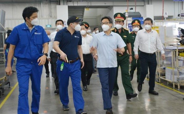 Deputy PM inspects business, production activities in HCM City hinh anh 1