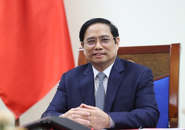 PM holds phone talks with US Presidential Envoy for Climate hinh anh 1