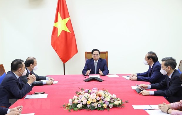 PM holds phone talks with US Presidential Envoy for Climate hinh anh 2
