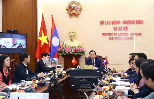 Vietnam, Laos talk enhancement of labour, social welfare cooperation hinh anh 1