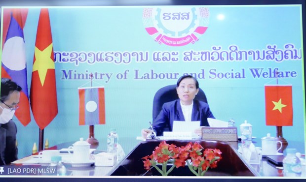 Vietnam, Laos talk enhancement of labour, social welfare cooperation hinh anh 2
