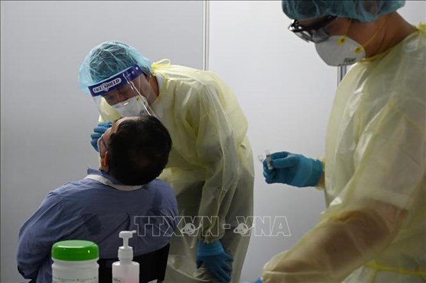 Singapore: COVID-19 patients unvaccinated by choice must cover own medical bills hinh anh 1
