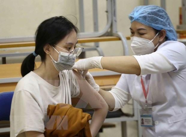 Vietnam reports 12,936 new COVID-19 infections on November 28 hinh anh 1