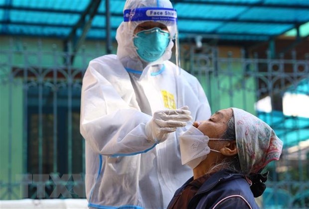 Vietnam reports 14,599 new COVID-19 cases on December 8 hinh anh 1