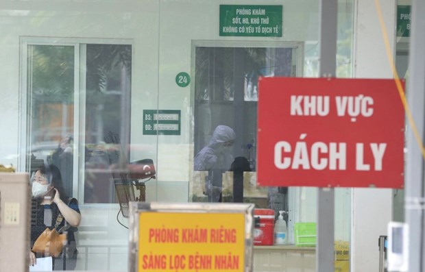 Vietnam logs 14,638 new COVID-19 cases on December 12 hinh anh 1