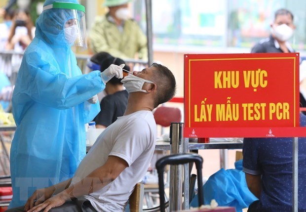 Vietnam reports additional 14,835 COVID-19 cases hinh anh 1