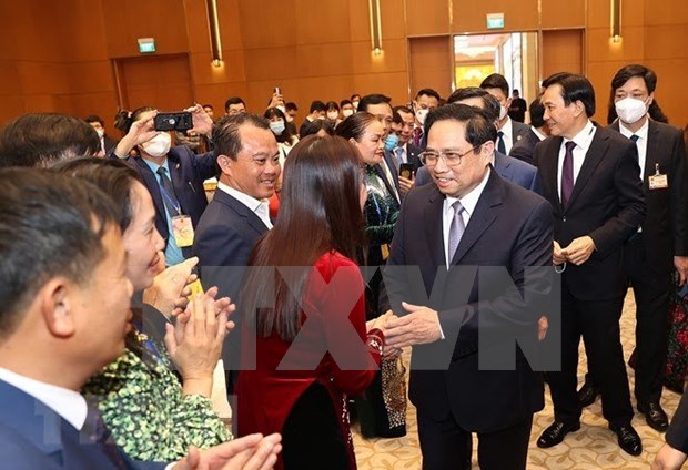PM meets OVs joining "Xuan Que huong" programme hinh anh 2
