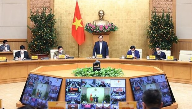 PM works with localities on COVID-19 control measures during Tet holidays hinh anh 1