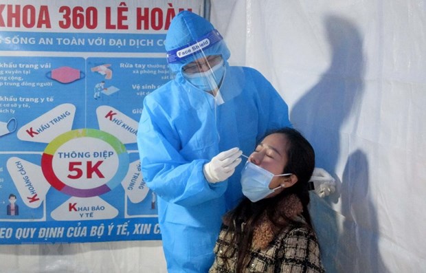 Vietnam records 26,487 new COVID-19 cases on February 11 hinh anh 1