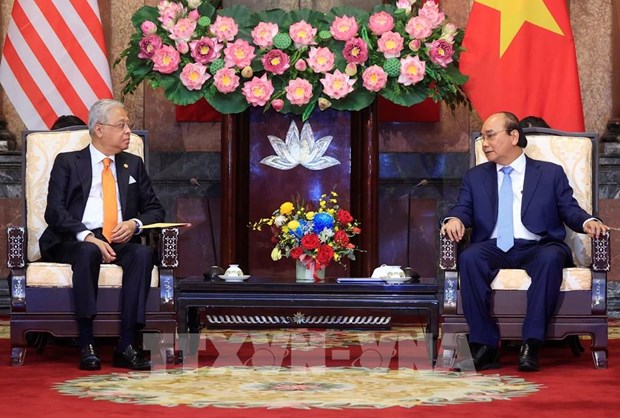 President suggests Vietnam, Malaysia take advantage of FTAs hinh anh 1
