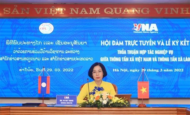 Vietnamese, Lao news agencies intensify cooperation hinh anh 1