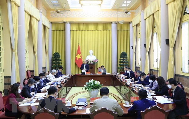 State President, experts discuss summary report on issues in building law-governed state hinh anh 1