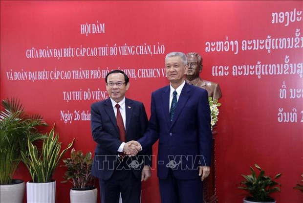 HCM City, Lao capital step up cooperation hinh anh 1
