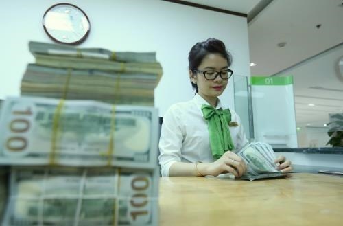 Reference exchange rate down 7 VND at week’s beginning hinh anh 1