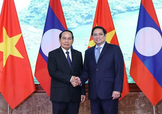 PM suggests bringing Vietnam-Laos economic cooperation on par with political ties hinh anh 1