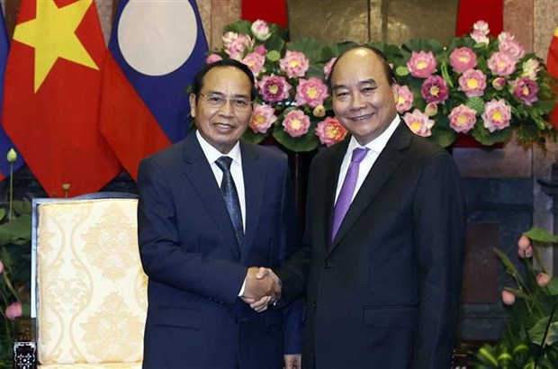 Vietnamese, Lao leaders hail significance of friendship year hinh anh 1