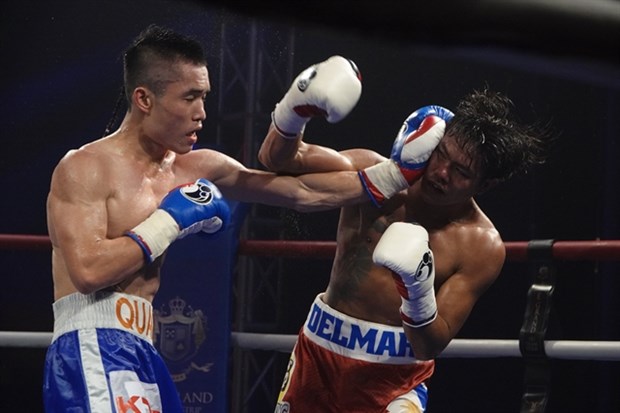 Quan defends title, heads to world level hinh anh 1
