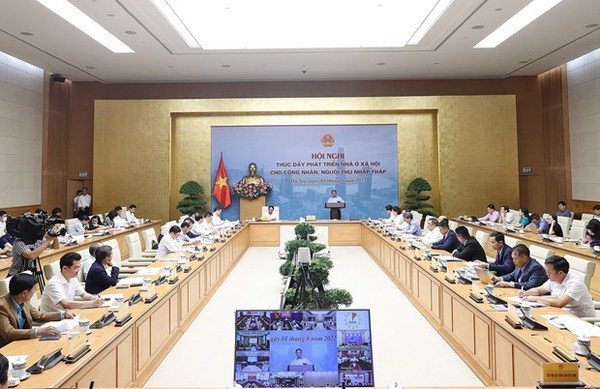 PM chairs conference on social housing development hinh anh 1