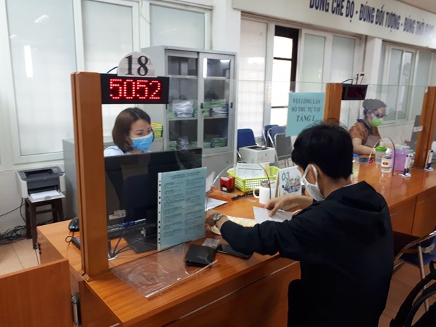 Nearly 300,000 COVID-19-hit workers receive financial aid from social security hinh anh 1