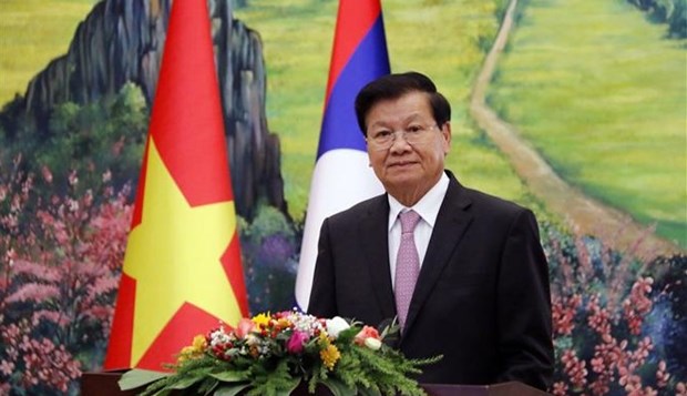 Lao leader calls on Lao, Vietnamese people to nurture special relationship hinh anh 1