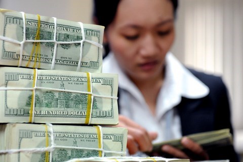 Reference exchange rate up 15 VND following Fed’s interest rate hike hinh anh 1