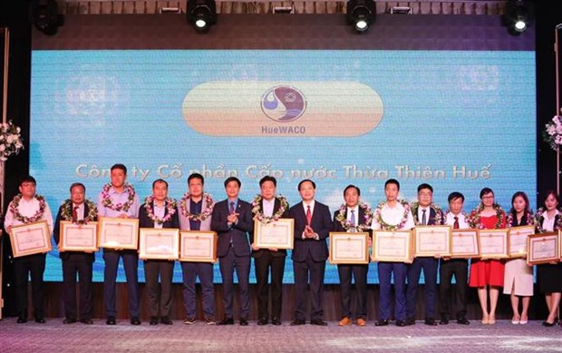 87 businesses honoured for implementing social insurance policies hinh anh 1