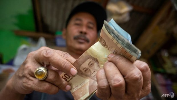 Indonesia’s central bank raises rates again to curb inflation hinh anh 1
