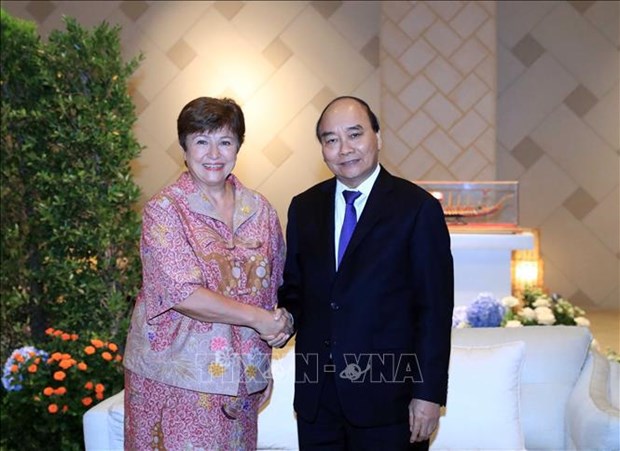 President meets Hong Kong, IMF leaders on APEC meeting sidelines hinh anh 1