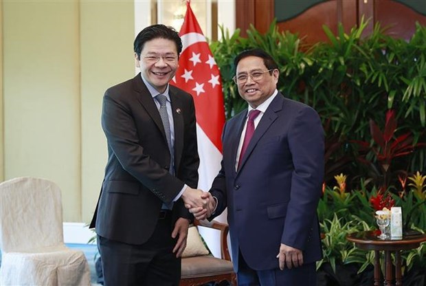 Prime Minister Pham Minh Chinh meets with Singaporean Deputy PM hinh anh 1