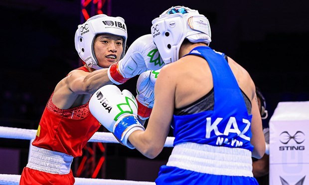 Vietnamese female boxer beats former world champion hinh anh 1