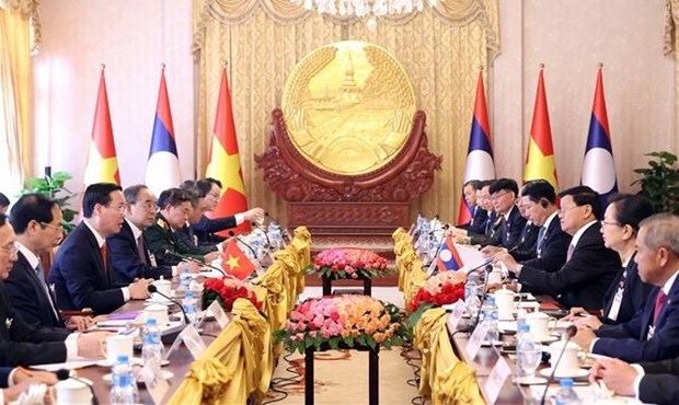 President holds talks with Party General Secretary, President of Laos hinh anh 2