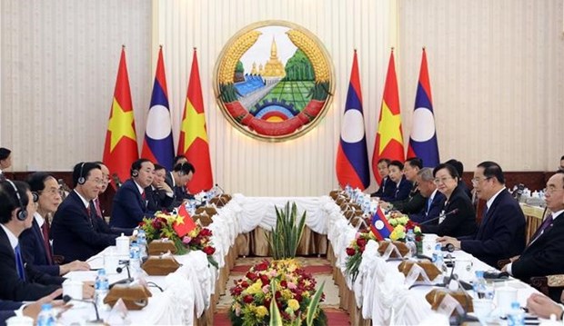 President wraps up two-day official visit to Laos hinh anh 1