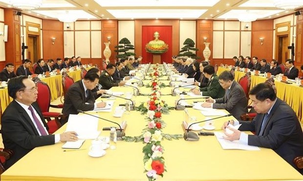 Top leaders of Vietnamese, Lao Parties meet in Hanoi hinh anh 1